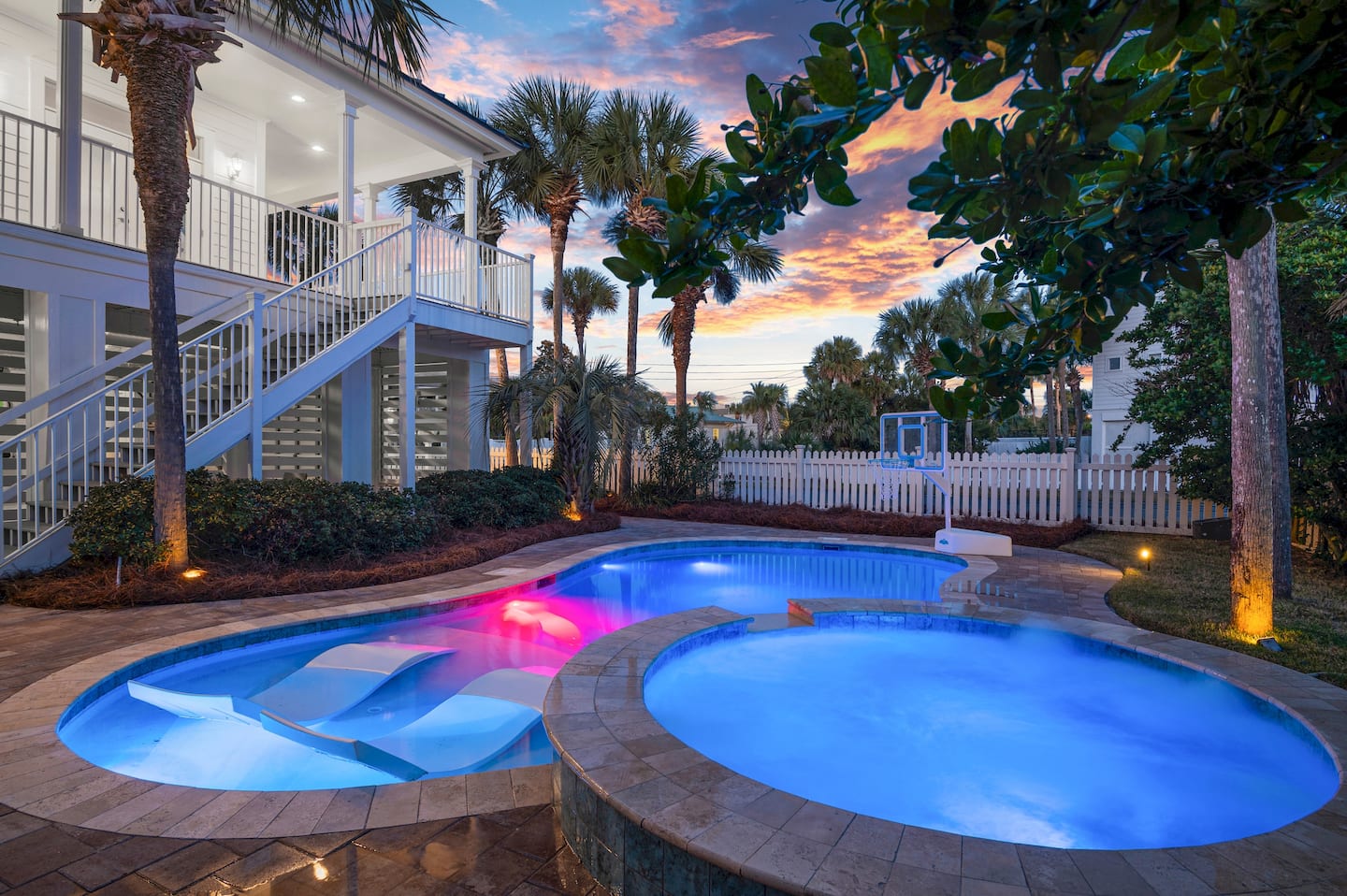 Private heated pool and hot tub at sunset at this Destin private pool vacation rental