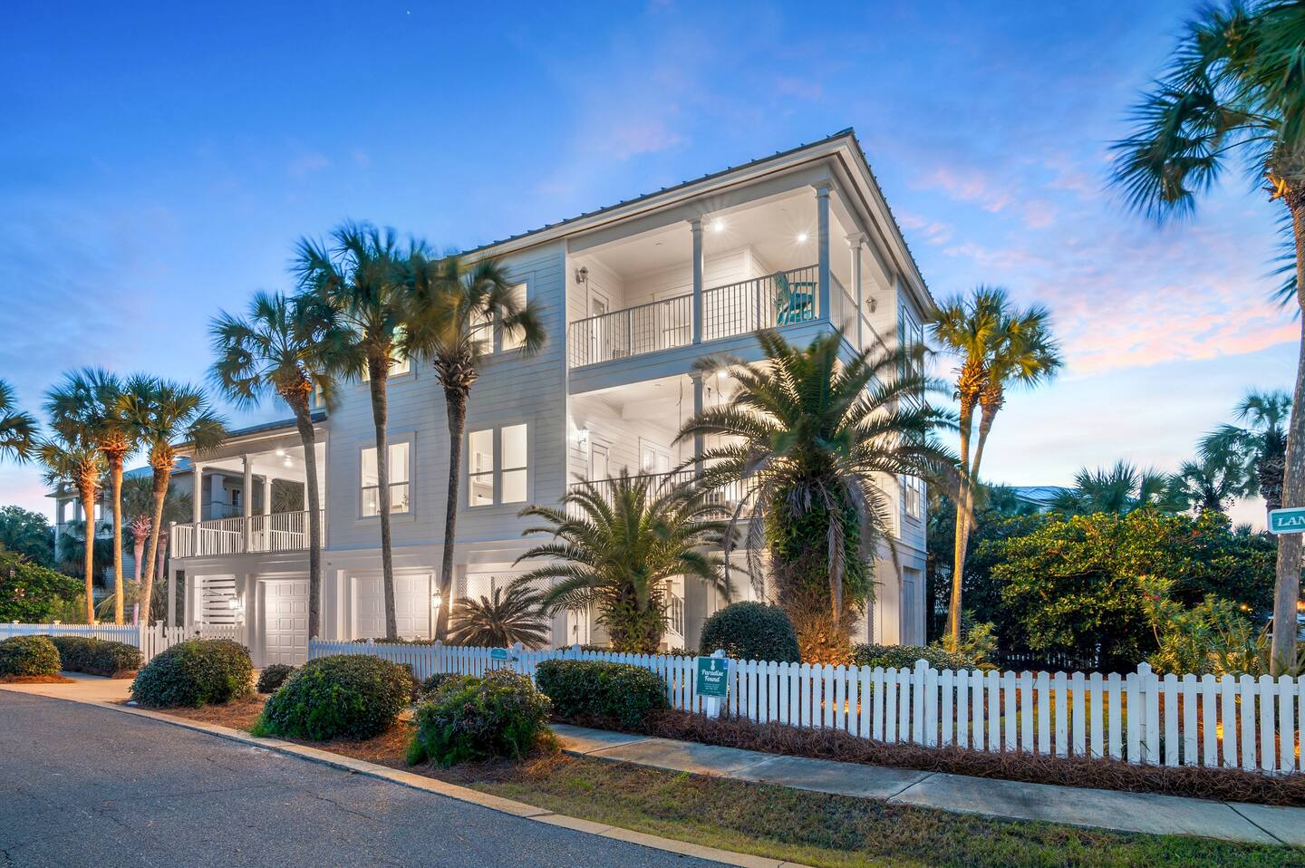 Paradise Found, a Destin Pointe vacation rental beach house, lit at twilight in Destin, Florida